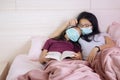 Daughter and mother sleeping with book and mask