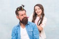 Daughter playing with hair. Ideas to entertain kids during quarantine. Family leisure concept. Girl dad hairdo Royalty Free Stock Photo