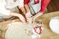 Positive little child carrying unready cookie with her little hands