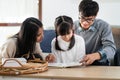 Daughter reading story with dad and mom Royalty Free Stock Photo