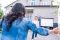 daughter running to mother for hug with smiling father Royalty Free Stock Photo