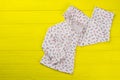 Daughter`s clothes on yellow background Royalty Free Stock Photo