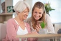 daughter showing mother how to use mobile phone Royalty Free Stock Photo