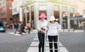 Daughter take care elderly woman walking across the street Royalty Free Stock Photo