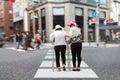 Daughter take care elderly woman walking on street. Royalty Free Stock Photo