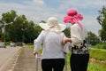 Daughter take care elderly woman walking on street Royalty Free Stock Photo