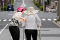 Daughter take care elderly woman walking on street Royalty Free Stock Photo