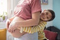 Daughter touching the belly of her pregnant mother Royalty Free Stock Photo