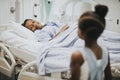 Daughter watching her grandmother sleep at the hospital Royalty Free Stock Photo