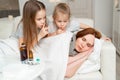 Daughters do not interfere with sick mom sleep. Royalty Free Stock Photo