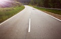 Empty ashpalt road with sunrays Royalty Free Stock Photo