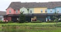 Colourful terraced houses with swimming pool and lake view