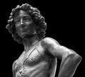 David killer of Goliath ancient statue. Biblical story. Antique sculpture of young man in armor isolated on black