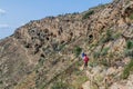 DAVIT GAREJA, GEORGIA - JULY 16, 2017: People walk on a trail around Udabno cave monastery at Davit Gareja monastic complex in Royalty Free Stock Photo