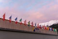 The congress center in Davos with flags of nations at sunrise during the WEF World Economic Forum