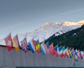 The congress center in Davos with flags of nations at sunrise during the WEF World Economic Forum