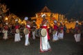 Davul Players perform in front of the Temple of the Sacred Tooth Relic in Kandy, Sri Lanka during the Esala Perahera.