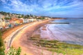 Dawlish Devon England with beach railway track and sea on blue sky summer day in HDR