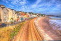 Dawlish Devon England with beach railway track and sea on blue sky summer day in HDR Royalty Free Stock Photo