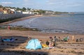 Holidaymakers on the beach in Dawlish, Devon, UK