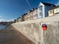 DAWLISH, DEVON, UK - November 12 2020: Plaque commemorating the engineering effort to repair the sea wall following a storm