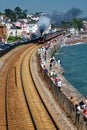 Dawlish England. Kings class steam train on coastal rail line 