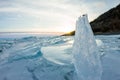 Dawn in the blue hummocks of ice lake baikal, in a snowy field i