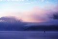 Dawn fog on Lake Teletskoye Royalty Free Stock Photo