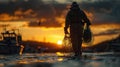 Dawn at harbor, silhouette of a fisherman carrying nets against the orange sky. A day in the hard life of professional fishermen Royalty Free Stock Photo