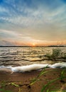 Dawn over the lake in the early summer morning against a cloudy sky Royalty Free Stock Photo