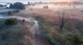 Dawn over the meadow. A wonderful summer landscape. Drone view. Morning fog. Royalty Free Stock Photo