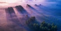 Dawn over the meadow. A wonderful summer landscape. Drone view. Morning fog. Royalty Free Stock Photo