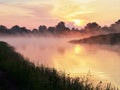 Dawn over a misty lake Royalty Free Stock Photo