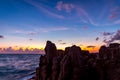 Dawn over sea and rocks on a tropical island Royalty Free Stock Photo