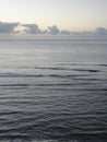 Dawn over sea with surfers nearby Diamond Head Royalty Free Stock Photo