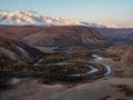 Dawn over a winding river in a mountain valley. Autumn landscape of Kurai steppe with Chuya river, mountain forest of Siberia