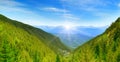Dawn in the picturesque mountains covered with forests. Royalty Free Stock Photo