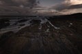 Dawn scene on Pembrokeshire coast, South Wales,UK with beautiful morning light on scenic rocky beach during low tide in Freshwater Royalty Free Stock Photo