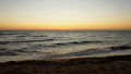 dawn at sea. sunset at sea. morning on the shore. sunrise. warm summer evening and the sea with light waves Royalty Free Stock Photo