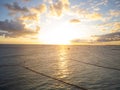 Dawn on the sea. There are many white fluffy clouds in the sky. Light swell on the water surface. Beautiful seascape, heavenly Royalty Free Stock Photo