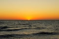 Dawn and sunset at sea and ocean. sunrise in the morning on the shore. the sun rises above the horizon. warm summer evening Royalty Free Stock Photo