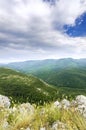 Dawn on the top from the misty peaks of the mountains Royalty Free Stock Photo