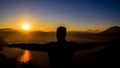 Dawn views of Lake Atitlan and hiker from the heights of Indian Nose pointview