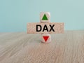 DAX price symbol. A brick block with arrow symbolizing that Deutsche Boerse DAX index price are going down or up