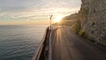 The sunset over a town on the Campania coast on the road to Amalfi.