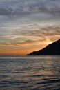 The sunset over a town on the Campania coast on the road to Amalfi.