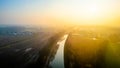 Dawn's First Light Over Serene Canal and Railway in Countryside