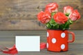 Day card with red roses in vintage cup Royalty Free Stock Photo