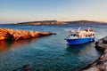 Day Cruise Boat at Spilia Beach Cove, Koufonisia Greek Island, Sunset Royalty Free Stock Photo