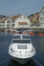 Day-cruiser and water-front houses Royalty Free Stock Photo